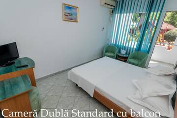 Фото номера Двухместный номер с 1 кроватью и балконом Отель Hotel Tismana г. Юпитер 3